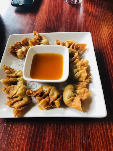 Vermicelli bowl with grilled meat and spring rolls at Hong An Calgary SE